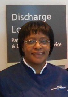 An image of a smiling nurse, Florence Cumberbatch.