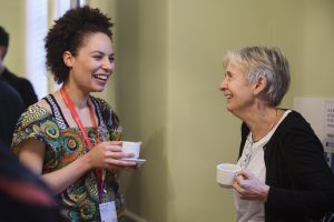 Delegates at Homeless Health 18 conference smile and laugh